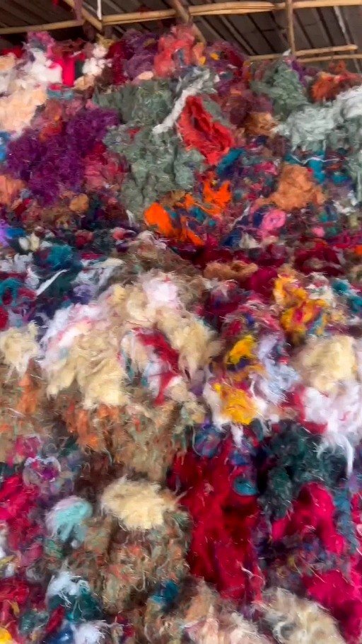 Colourful Bukka and polyester saree textile waste, illustrative frame from user video